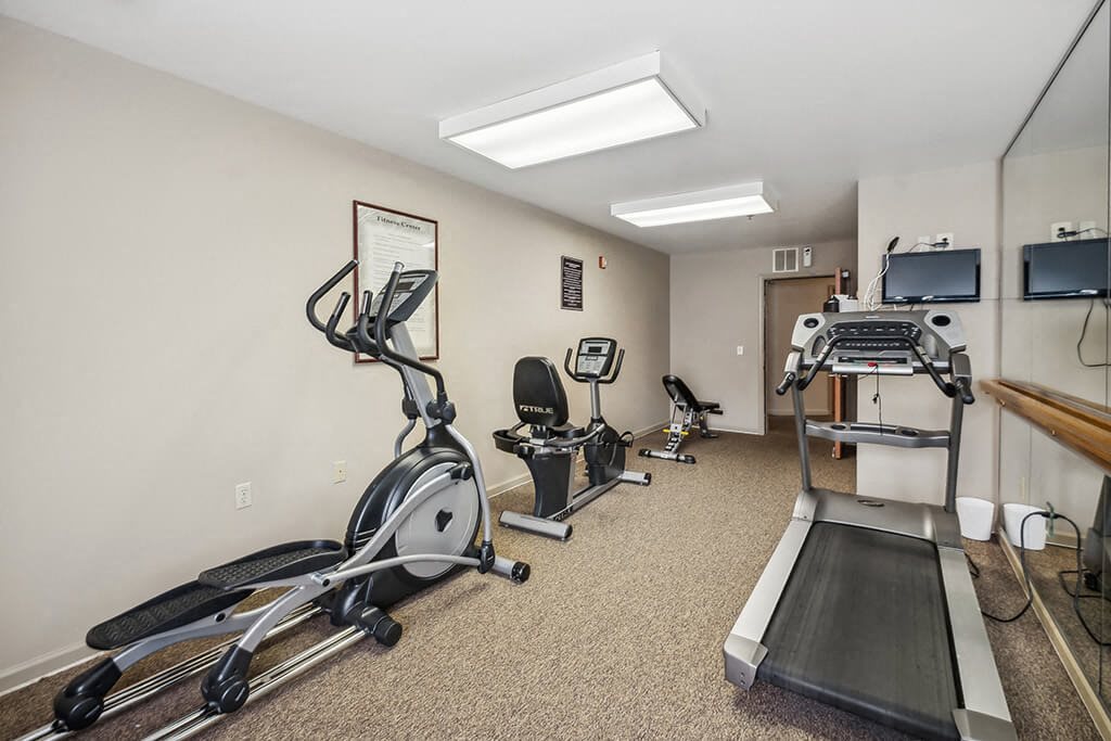 Fitness center treadmill at The Woods at Victoria Park Apartments in Woodbridge VA